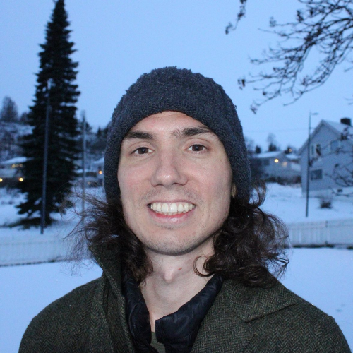 Nat Delnova smiling outside in the snow